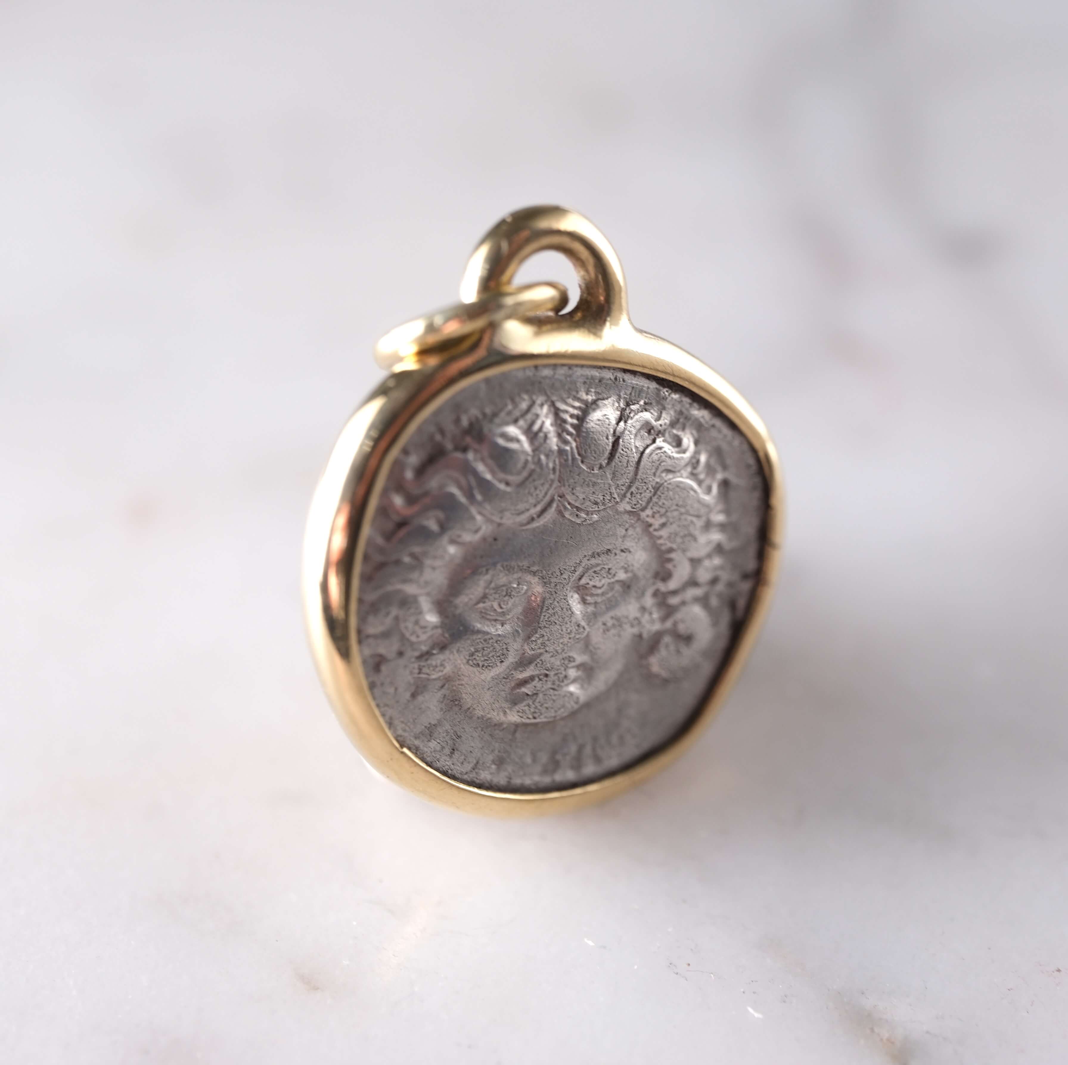 Medusa and Aurora Hand Set in a Custom 18k Gold Bezel