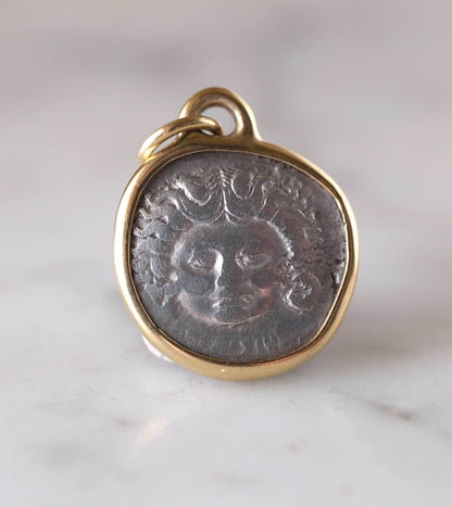 Medusa and Aurora Hand Set in a Custom 18k Gold Bezel