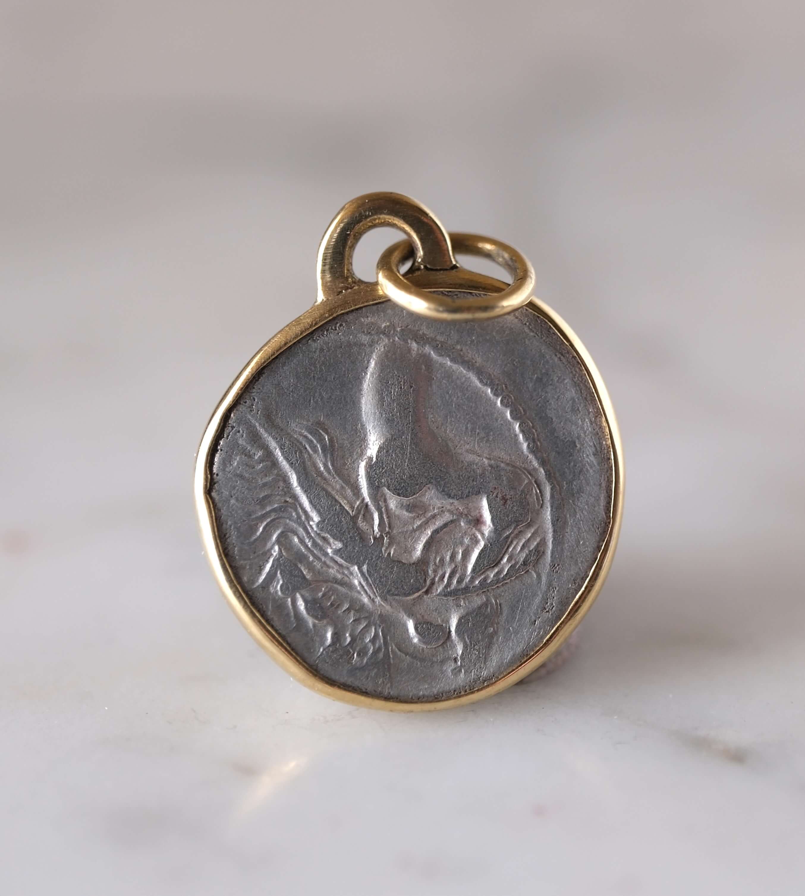 Medusa and Aurora Hand Set in a Custom 18k Gold Bezel